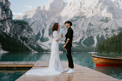Couple saying their vows during their multi day elopement in the Italian Dolomites on Lago di Braies