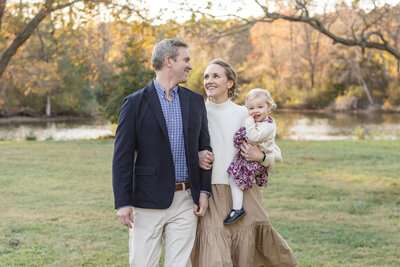 Family smiling at each other during their holiday photos