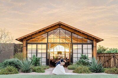 The Paseo Weddings reception barn at sunset