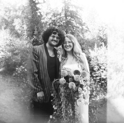 Black and white holga film image of a couple after their City Hall Portland Elopement at Hoyt Arboretum.