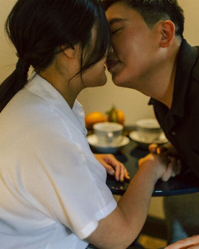 Couple, almost kissing, casual, enjoying tea
