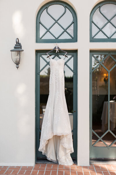 Fine art wedding photography on the California coast – bride walking along the shore at a luxury Malibu estate wedding.