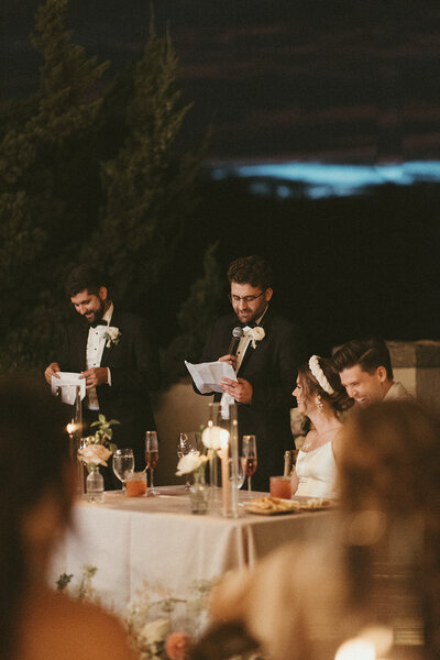 Best man giving a speech during a candle lit reception, Intimate Wedding & Elopement Photography NYC and Asheville Area