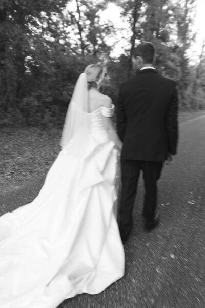 Bride and Groom walking away together.