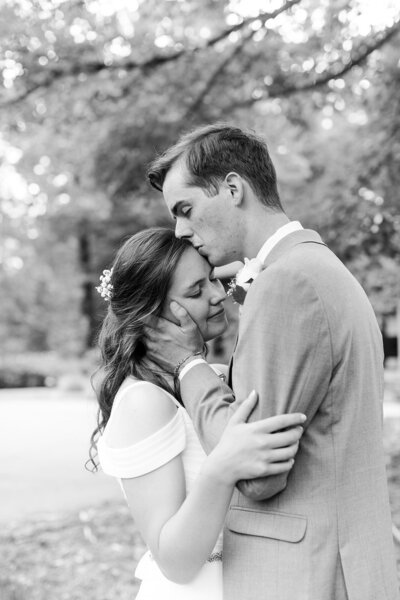 Bride and groom share a romantic private moment just after getting married
