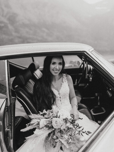 black and white image bride in car
