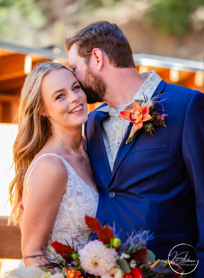 groom whispering to bride