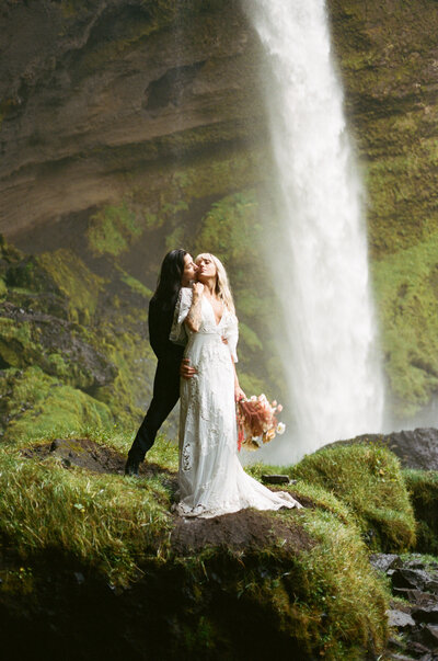 Couple embracing and laughing with joy towards each other