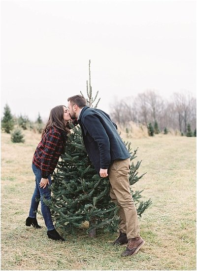 Holiday Engagement Photos at Christmas Tree Farm in Red Plaid by Colorado Wedding Photographer © Bonnie Sen Photography