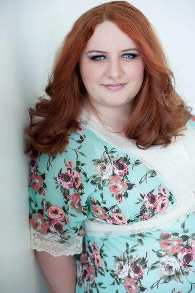 Red headed  boudoir photographer  Andrea Baue in Minneapolis MN