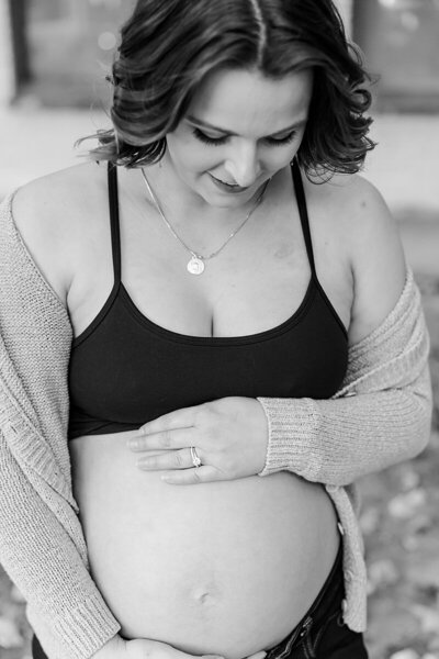 Glowing mother-to-be in a scenic Charlottesville location, capturing the excitement of pregnancy