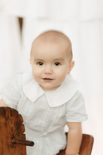 Baby boy in heirloom bubble with wooden rocking horse by Dothan Baby Photographer