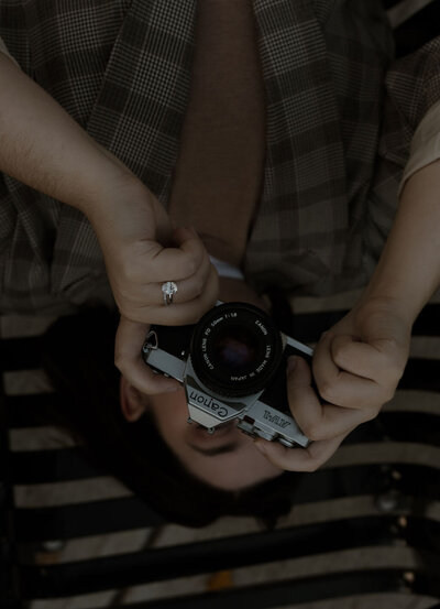 intimate wedding photographer holding her camera