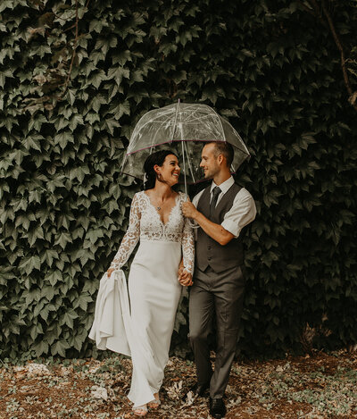Bride and groom with Umbrellas