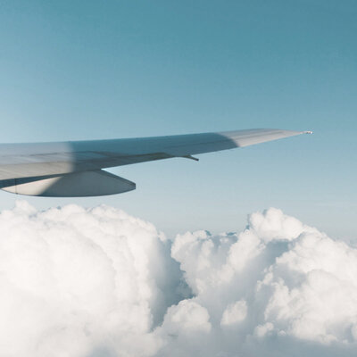 Airplane wing in clear sunny skies