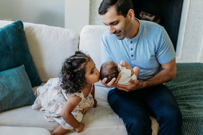 Dad and baby in-home newborn photoshoot in Northbrook, IL by Moments by Meli