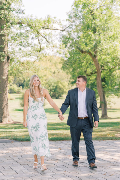 Couple walking holding hands at the Willows at Ashcombe for engagement session