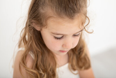 sweet girl with big eye lashes showing her big personality