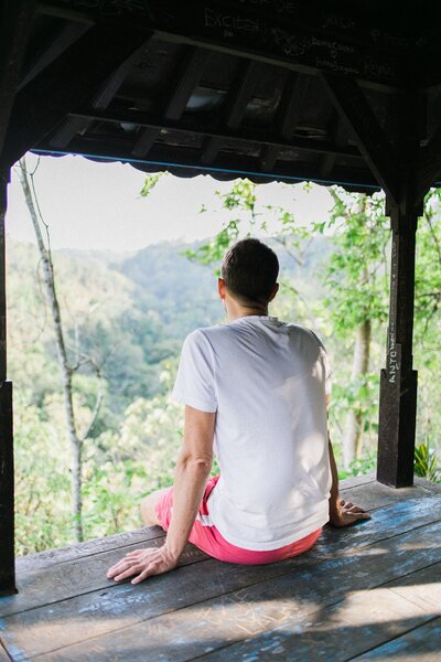 A man in solitary peace, surrounded by tranquility and embracing a moment of serene solitude