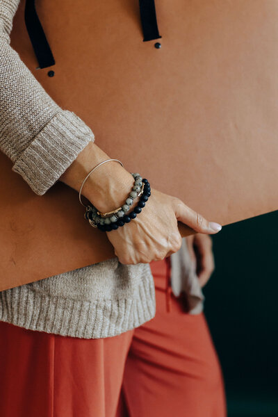 person holding a large portfolio