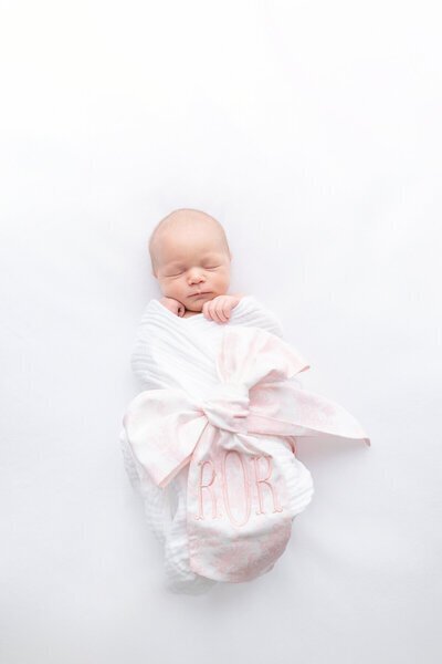 Swaddled newborn portrait in monogram blanket for Savannah, GA photography session