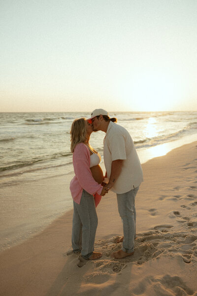30a couple kissing on the beach