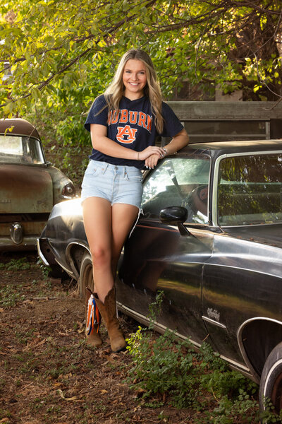 senior-girl-posing-by-junkyard-car