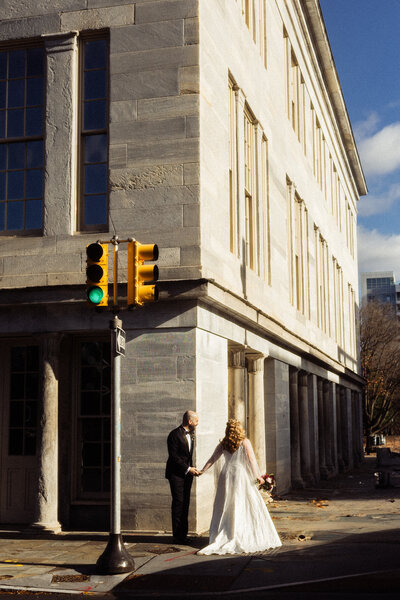 A couple laughing during their cinematic engagement shoot