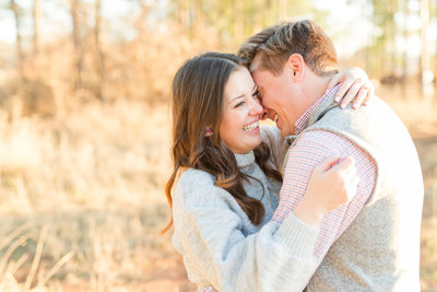Couple nuzzling in during engagement photos