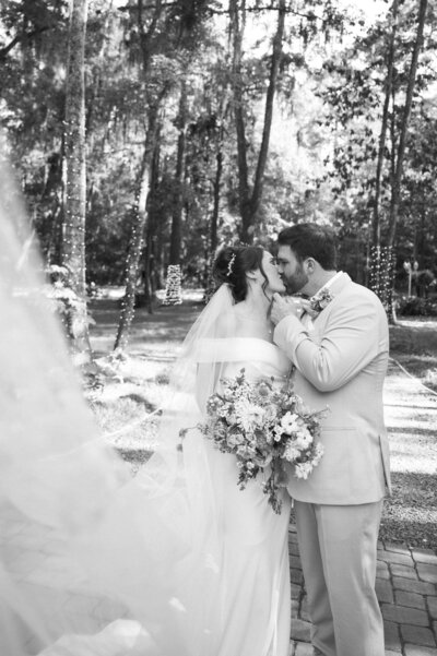 bride and groom kissing at mackey house in Savannah