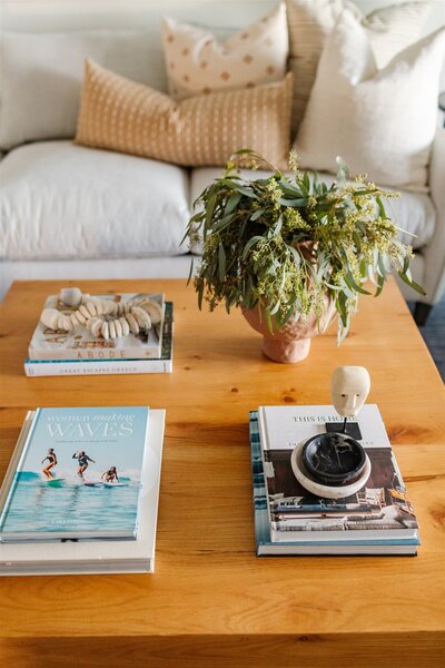 Book and plant accent on wooden living room table
