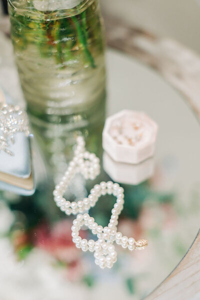 Wedding detail shot of ring with purple flowers