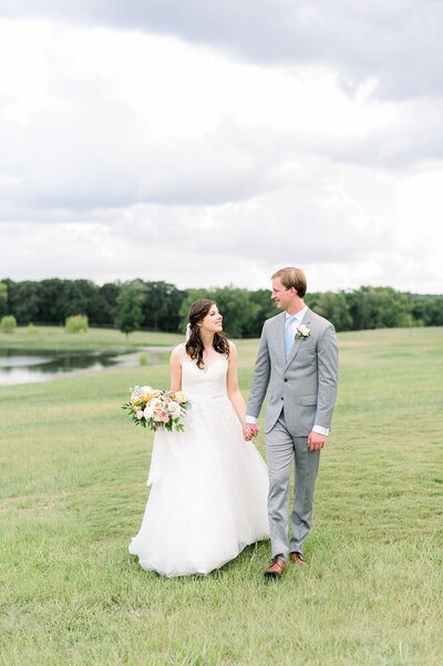 Bride and groom walk up memorial steps at their DC wedding