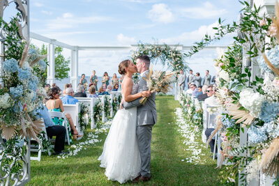 Newlyweds first kiss at Neuse Breeze Venue.