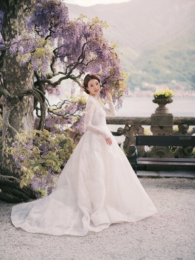 Bridal portrait in wisteria during a villa del Balbianello wedding, by luxury destination wedding photographer Andreas K. Georgiou  