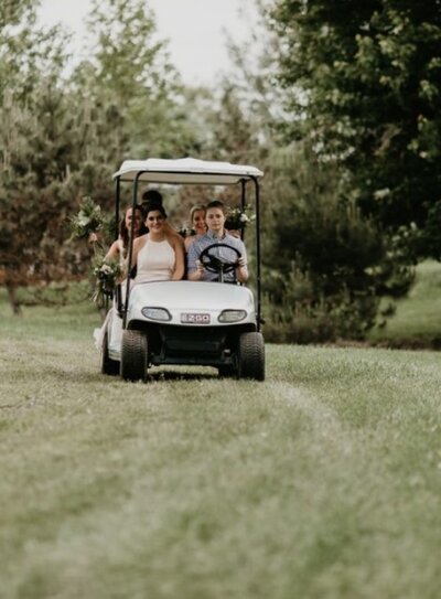 Guests riding Golf cart at willowbrook