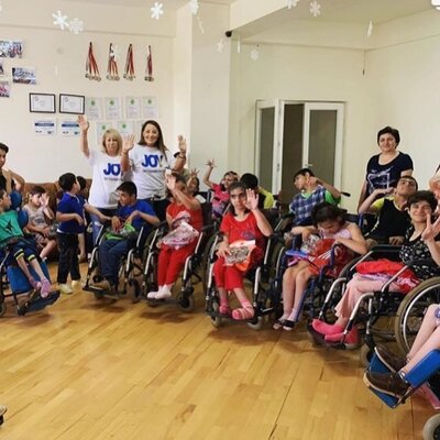 JOY volunteers photo with children