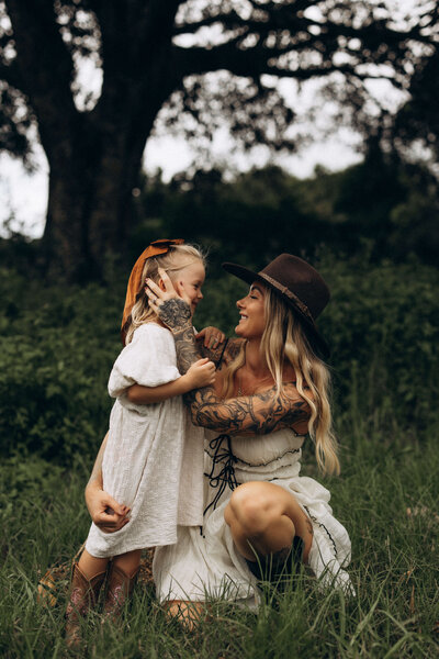 motherhood-connection-tattooed-mum-laughing-with-daughter