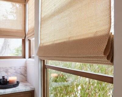 Natural woven shades in a modern bathroom
