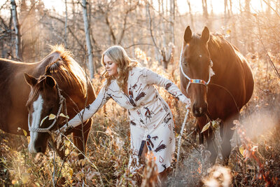 girl with 2  quarter horses