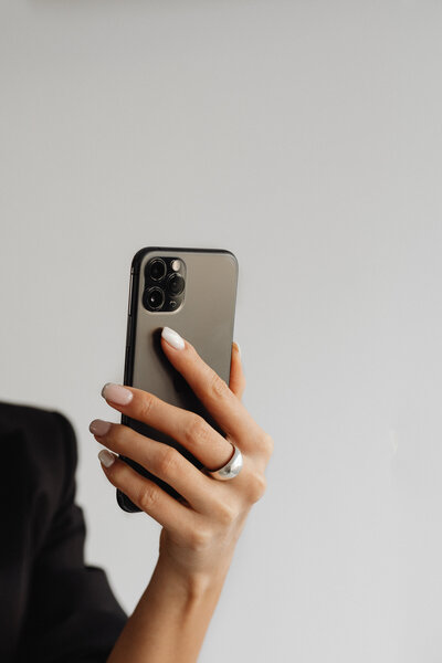 Woman holding her cell phone