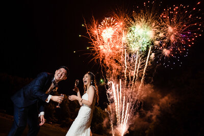 Fireworks going off as the couple celebrates their las vegas wedding