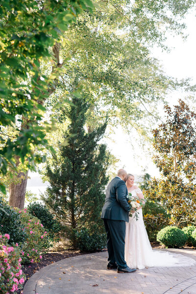 Bride and Groom taking portraits near greenery. Captured by DC Wedding Photographer Bethany Aubre Photography.