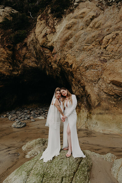 lgbt female couple smiling and hugging