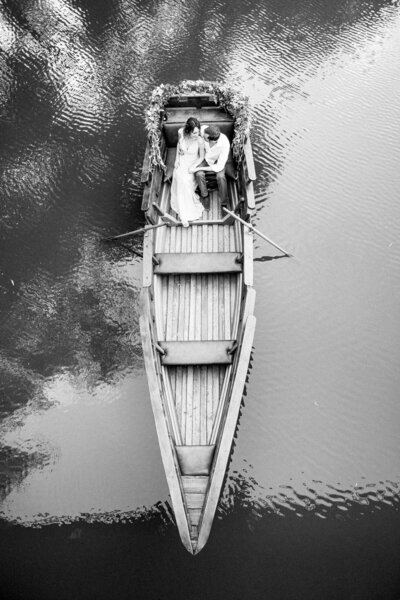 Bride and groom portrait photo on a boat going over patagonia lake.