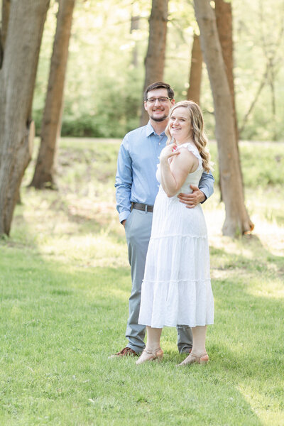 thumbnail photo of a young couple posing at a park at golden hour