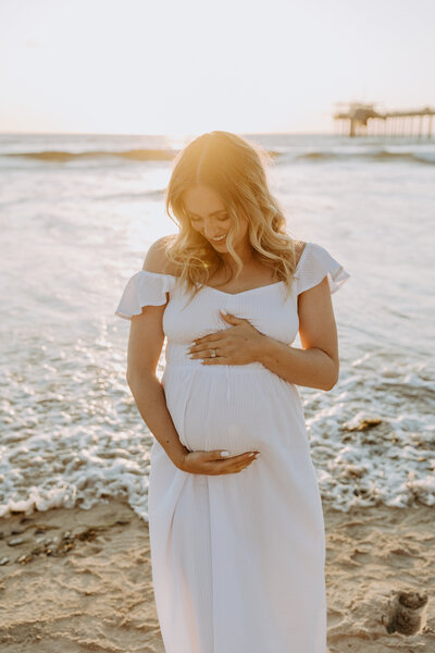 Natural Candid Documentary Family Maternity Baby Pregnancy Announcement Photo shoot at La Jolla Windansea beach at sunset - Couples Mom and Dad San Diego Maternity Photographer