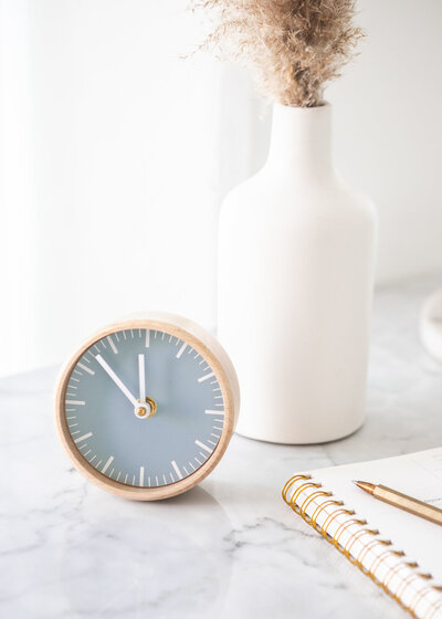 Dusky blue lifestyle clock and vase