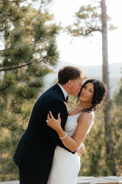Terrel kissing Luisa at their Breezy Point Picnic Area elopement.