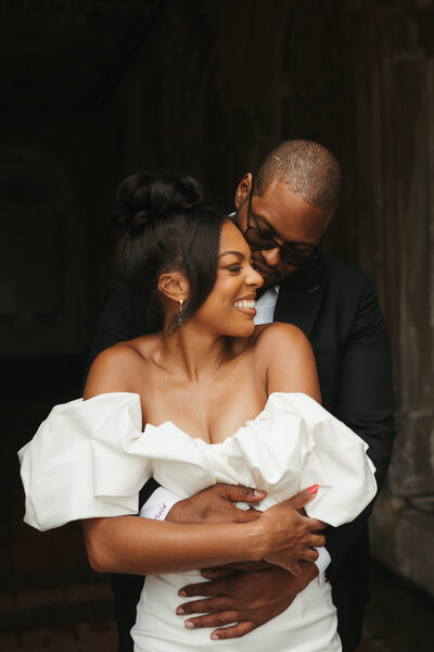bride and groom hugging